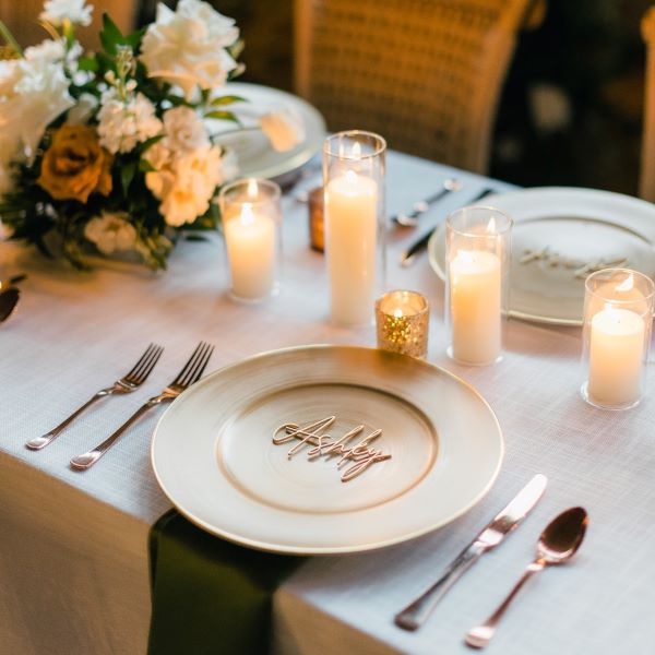 Wedding table setting. The plate says, "Ashley."