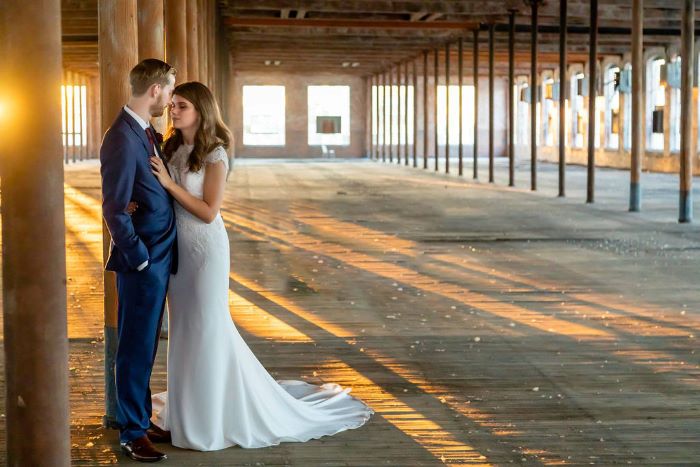 Bride and groom portrait in the industrial warehouse space.