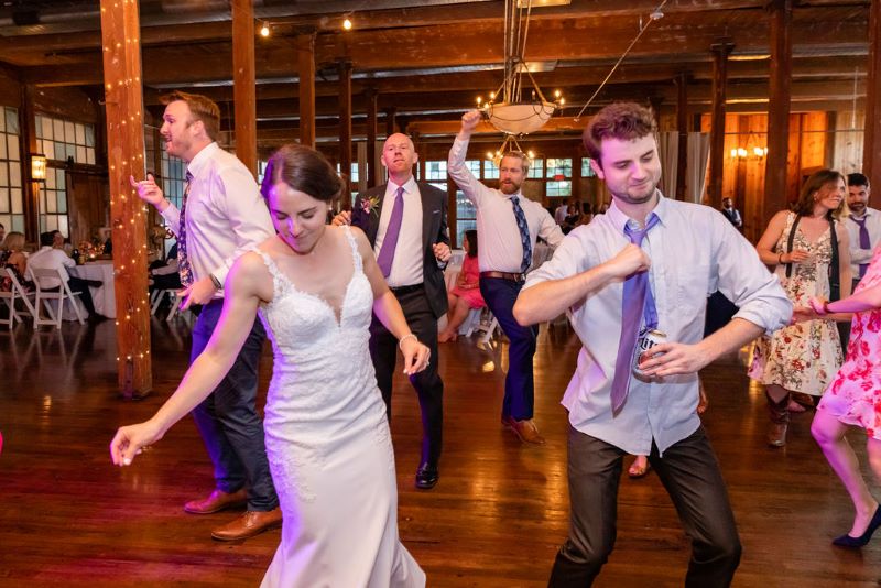Guests dancing in the rustic industrial Event Hall.
