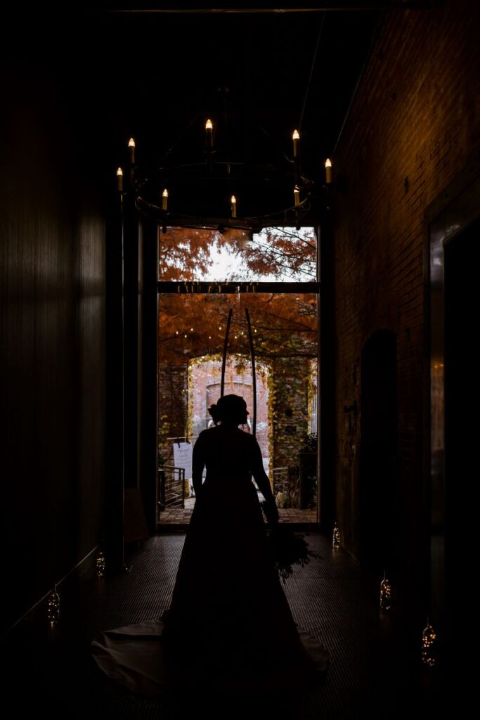 Silhouette portrait of bride in The Cotton Mill hallway.