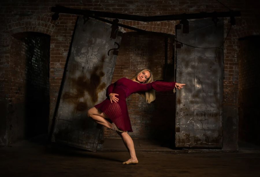 Dance photography in front of large original industrial doors in the weaving room warehouse space.