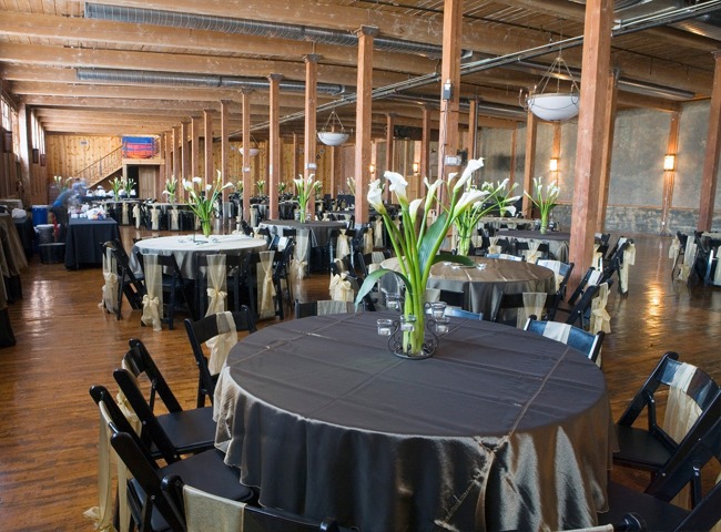 Event setup with black chairs and black tablecloth in the Event Hall.